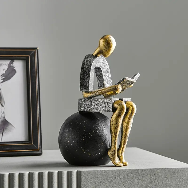 Timeless Reflection: Luxe Golden Abstract Reader Sculpture