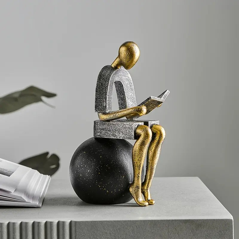 Timeless Reflection: Luxe Golden Abstract Reader Sculpture
