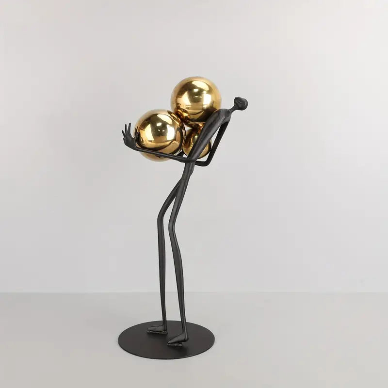 Trinity in Gold: Elegant Metal Figurine Art Piece