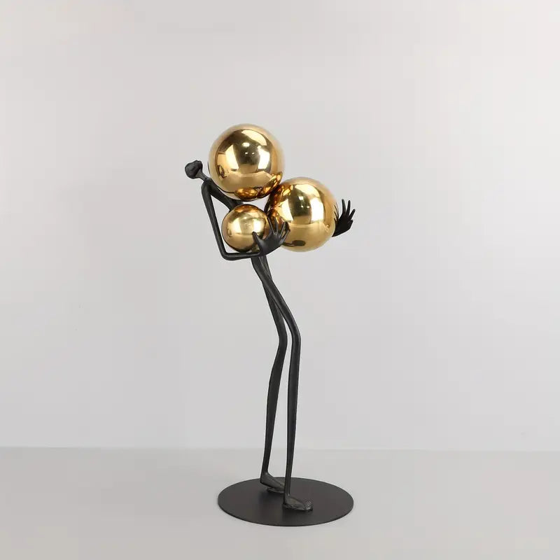 Trinity in Gold: Elegant Metal Figurine Art Piece